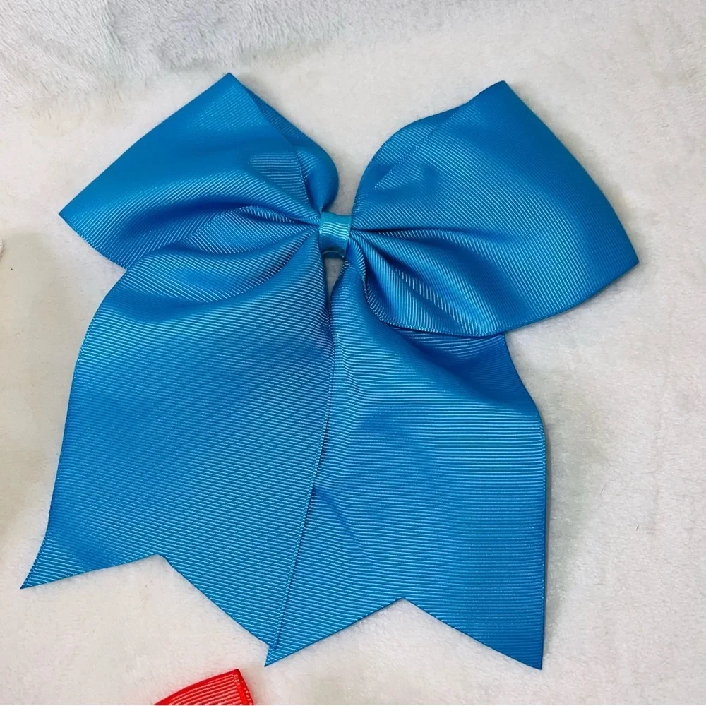 7 Cheerleader/Dance Bows Different Sizes, Colors & Holders. Missing Black Bow